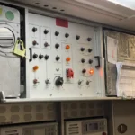 the control panel of an airplane with many buttons